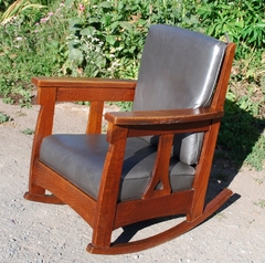 Charles Limbert large rocker with back cushion & heart cut out design in a single slat under each arm. 